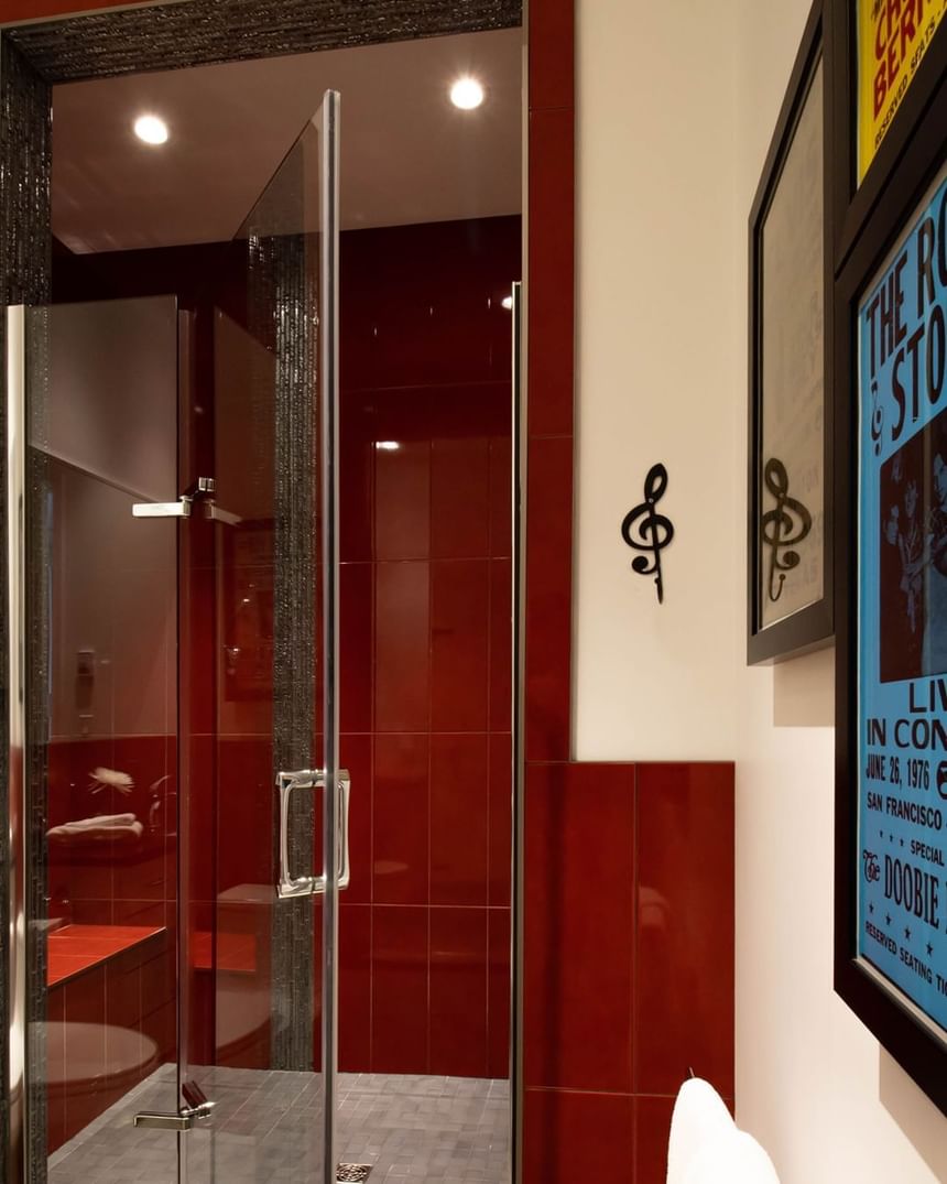 red tile shower with music note and concert posters