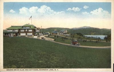 Vintage postcard of Brown Swan Club and cottages in The Lodge at Schroon Lake