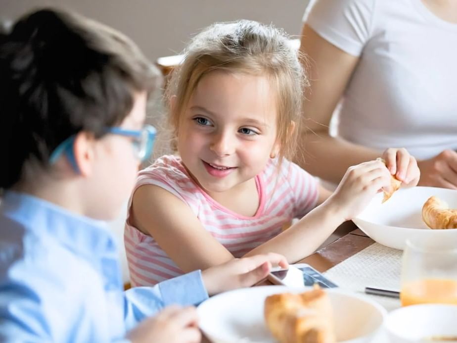 Two kids enjoying free food & stay at Hotel Grand Chancellor Townsville