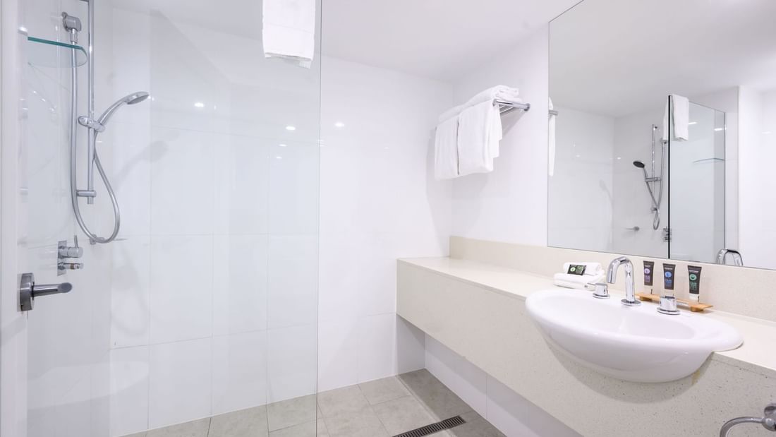 Modern bathroom with walk-in shower and white vanity in Classic Rooms at Novotel Sunshine Coast Twin Waters