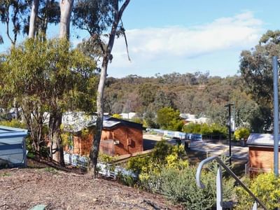 Terraced houses with lush greenery and a scenic view at La Trobe University.