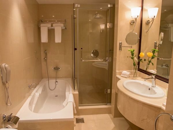 Bathroom bath with shower at Strato Hotel by Warwick 
