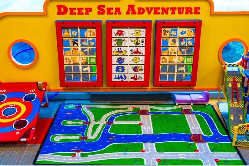 Vibrant indoor play area at The Diplomat Resort called Deep Sea Adventure, with interactive games for children