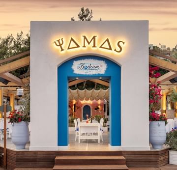 Exterior view of Yamas À la Carte Restaurant with sea view at Titanic Luxury Collection Bodrum