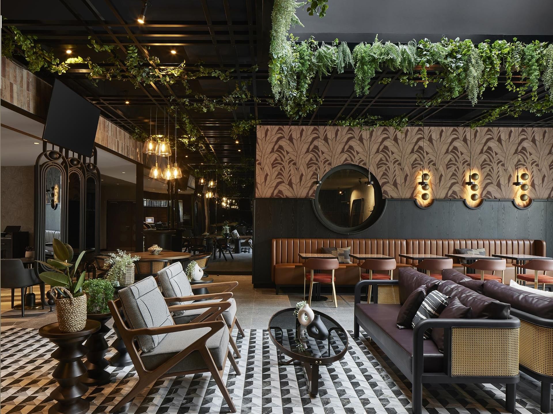 Cafe interior with plush seating and ornaments in Winter Garden at Titanic Comfort Kurfürstendamm