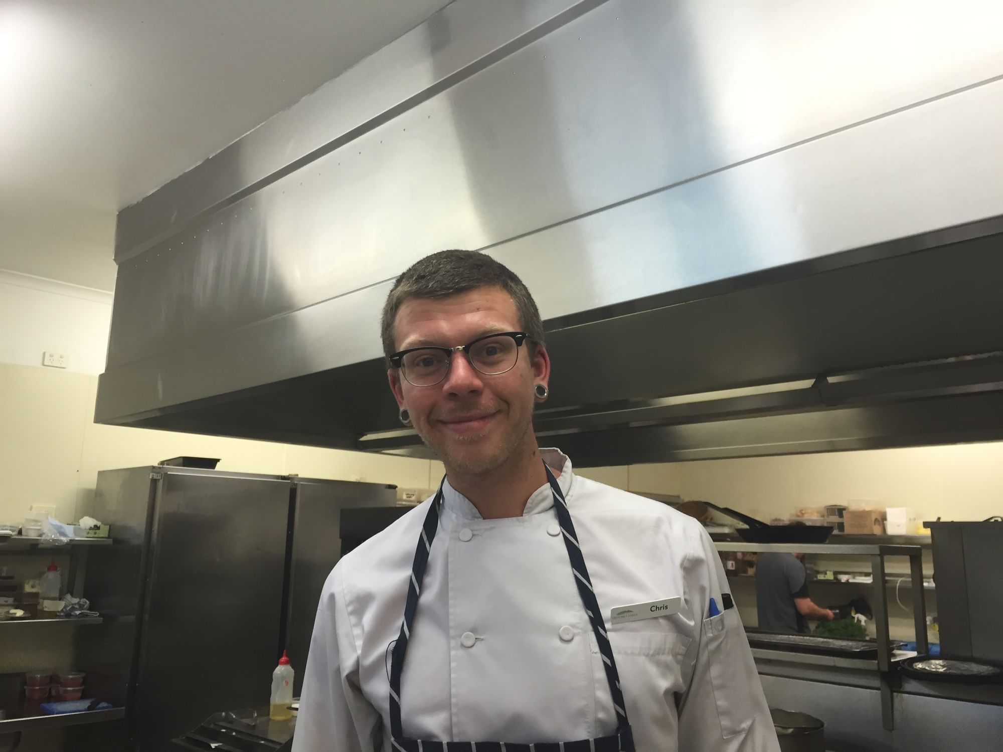 A chef in a prep station of a restaurant at Freycinet Lodge