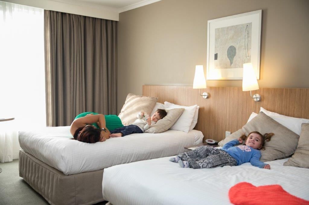 A family staying in Standard Twin room at Mercure Sydney