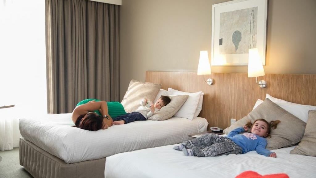 A family staying in Standard Twin room at Mercure Sydney