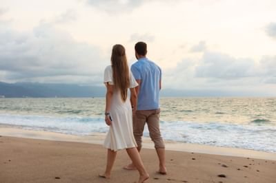 Couple walking by the sea near Villa Premiere Boutique Hotel & Romantic Getaway
