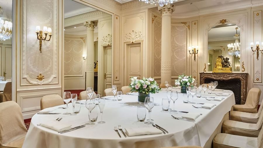 Long table setup with flora vases and glassware in the meeting room at Hotel Westminster Paris