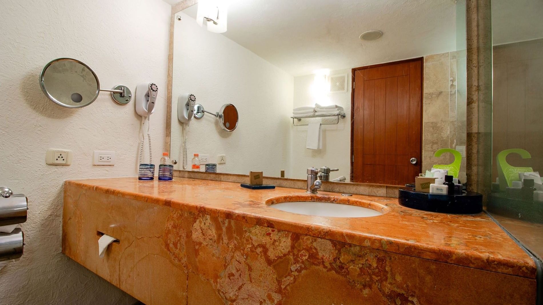 2 Double Camino Real Club Executive bathroom vanity with orange countertop and large mirror at Camino Real Guadalajara