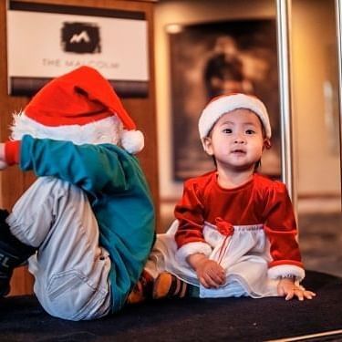 Little kids with Christmas hats on at The Malcolm Hotel