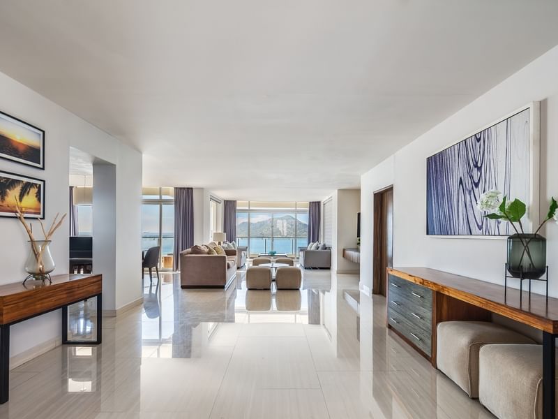 Penthouse Luxury with a spacious living area, polished floors, and a balcony overlooking the blue ocean at Sunvivia Mazatlán