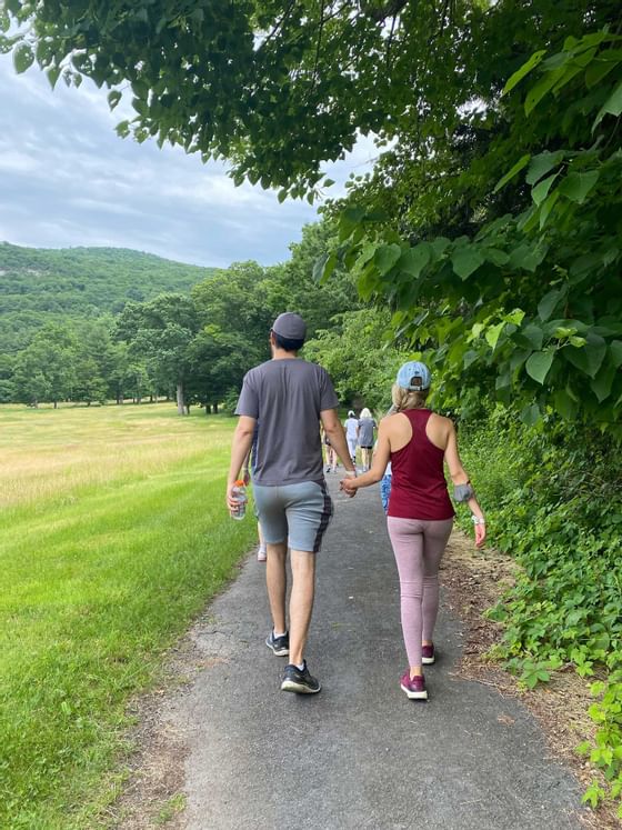 Couple walking on a walkway at a park near Honor’s Haven Retreat