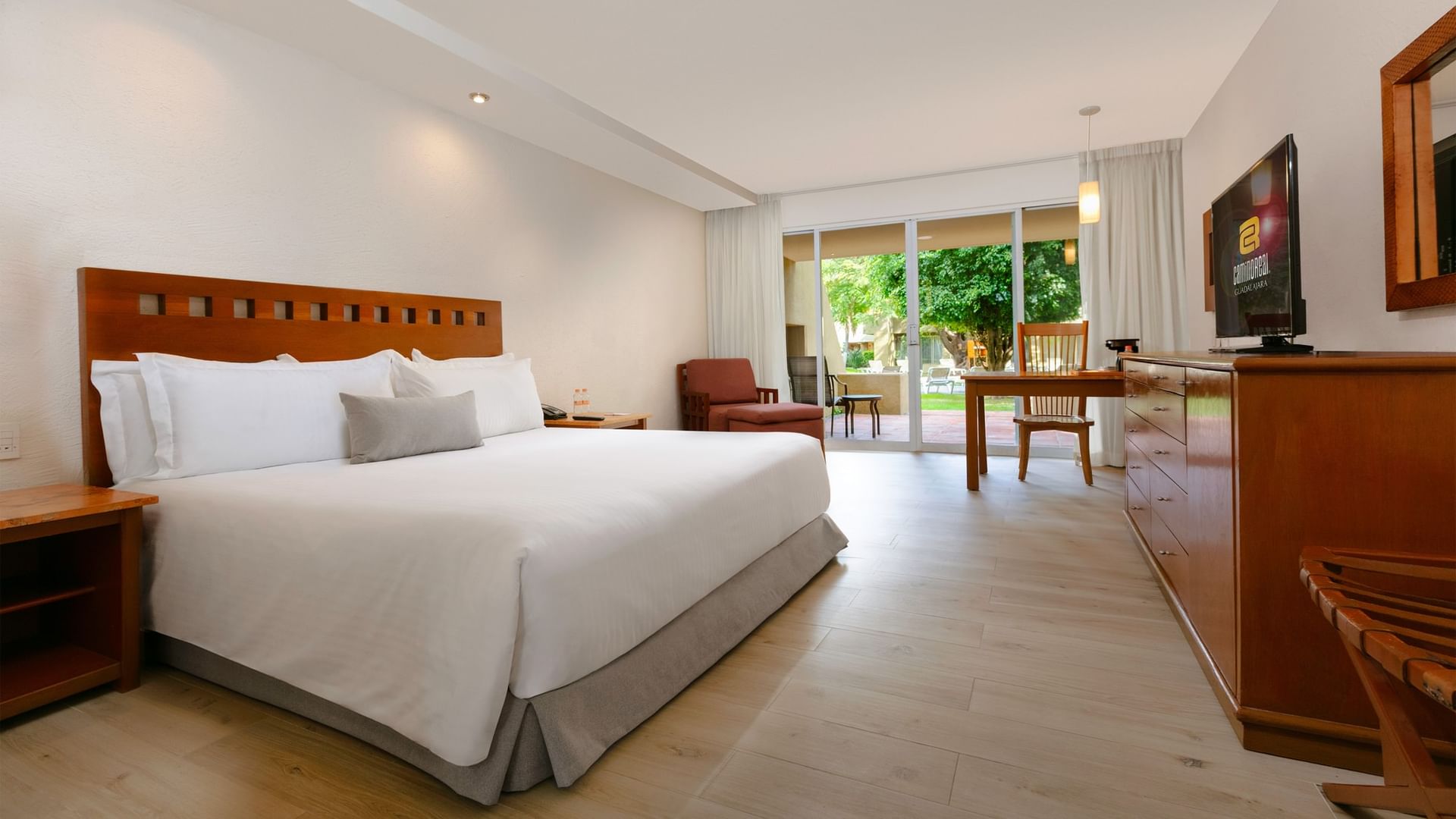 Spacious King Deluxe room with large bed and balcony at Camino Real Guadalajara in Zapopan