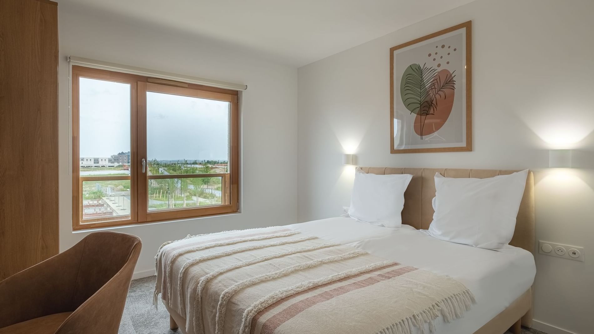 Interior of the Double Room with a king bed at Hotel Amiens Sud