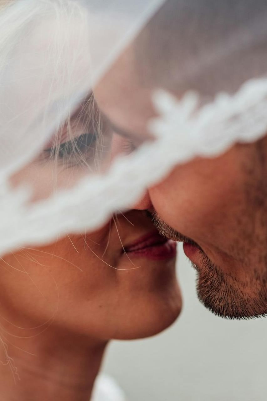 Close-up look of bride and groom kissing each other at The Terraces Resort & Spa