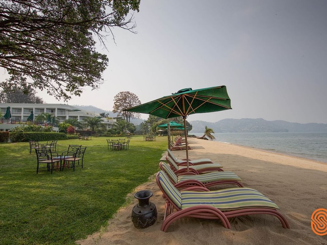 Sunbeds near the beach at Lake Kivu Serena Hotel