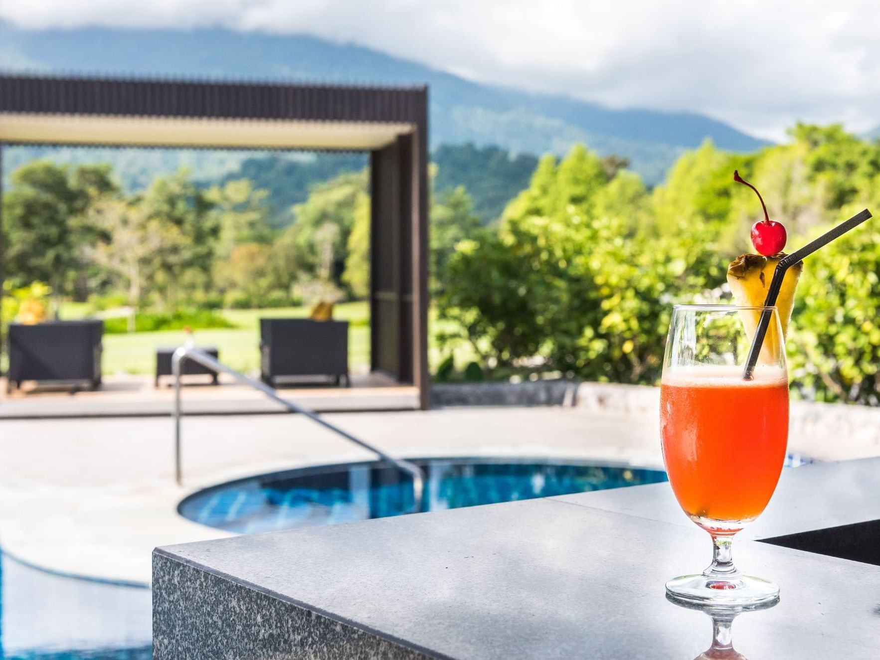 Close up of a cocktail served by the pool at Maitria Hotel Sukhumvit 18