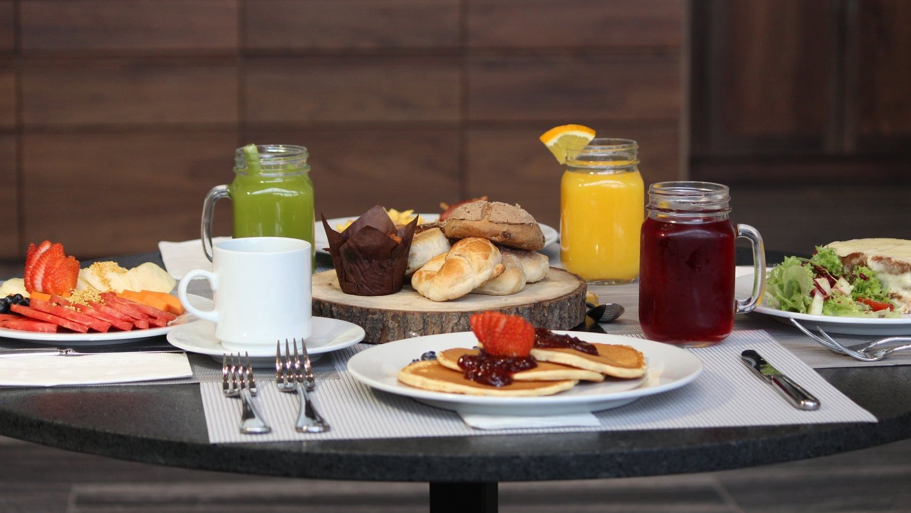 A beautifully arranged breakfast spread on a table at Fiesta Inn Suites Aeropuerto Del Bajío