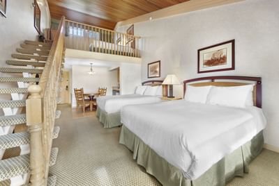 Arranged beds with staircase in Pool Facing Loft with Kitchenette at Fairmont Hot Springs Resort