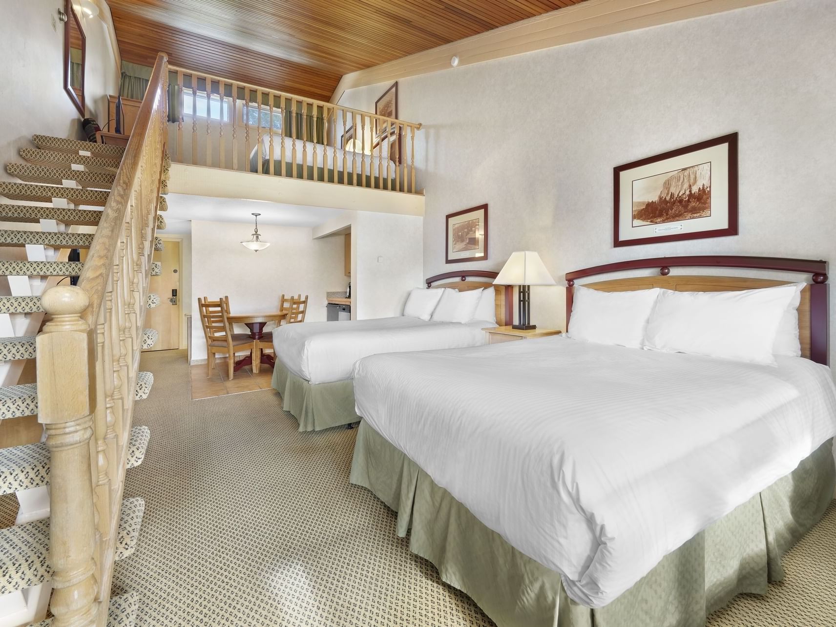 Arranged beds with staircase in Pool Facing Loft with Kitchenette at Fairmont Hot Springs Resort