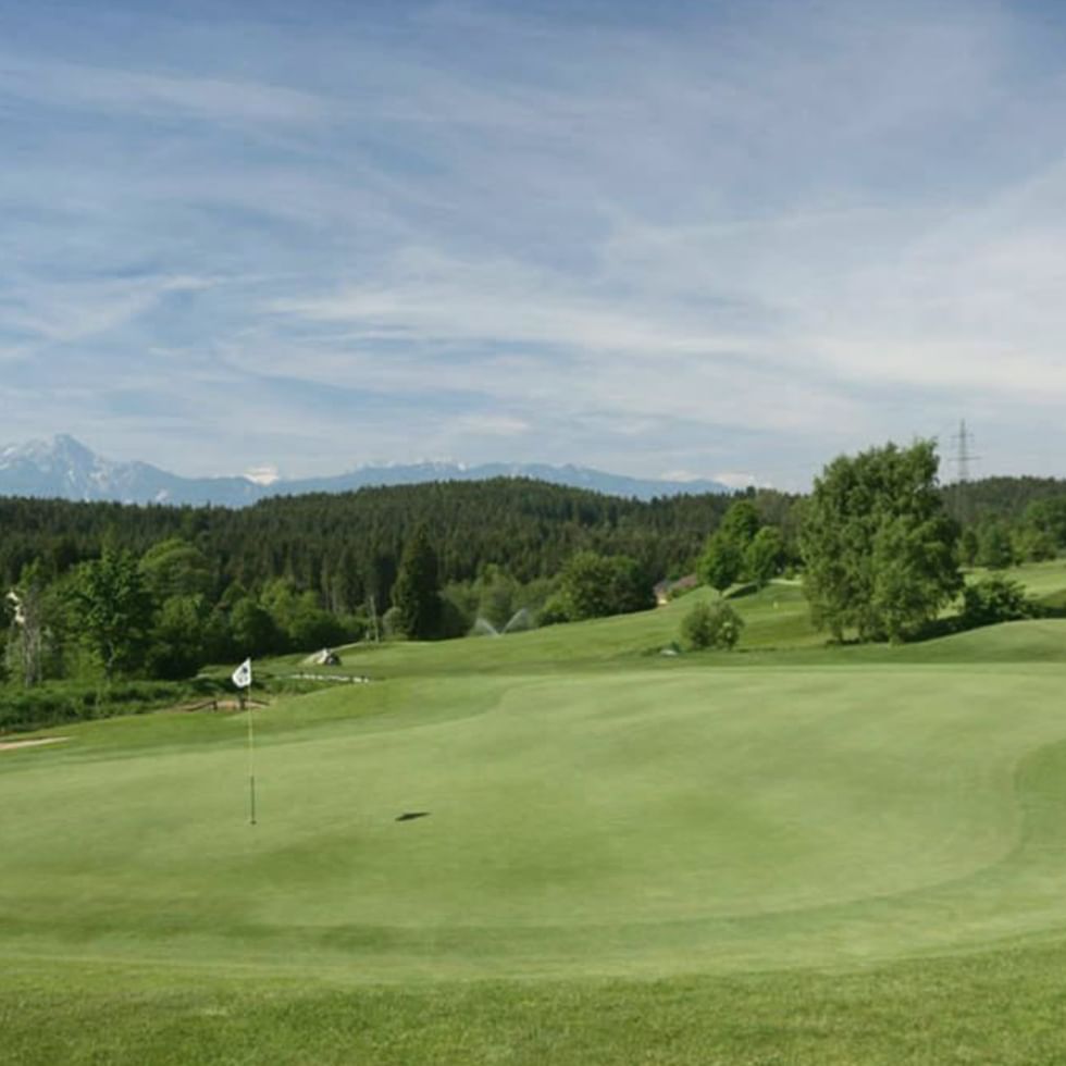 Golf course by the mountains at Falkensteiner Hotels