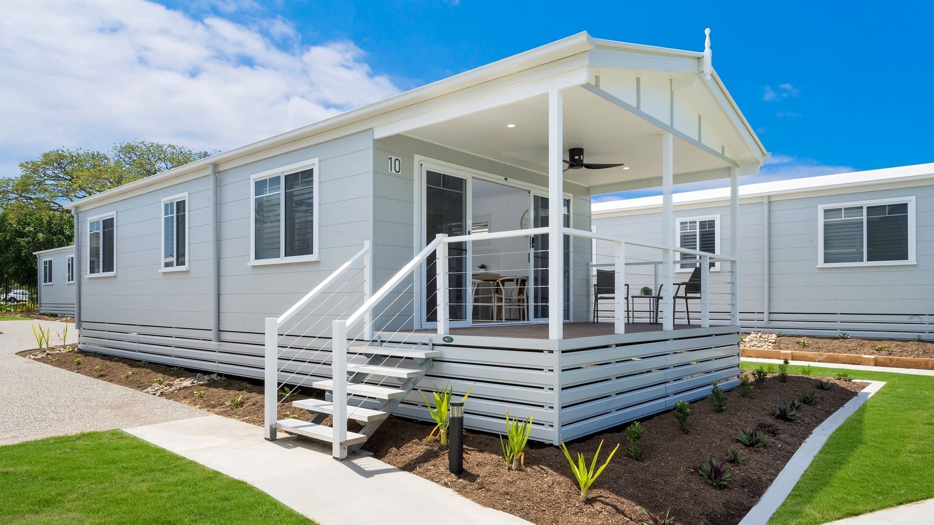 Deluxe Bungalow 2 Bedroom with a welcoming porch surrounded by landscaped gardens at Mercure Hotel Townsville