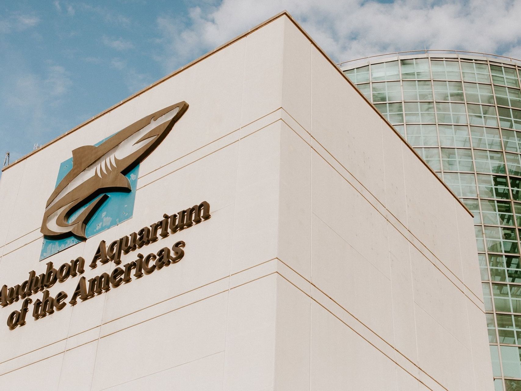 View of the Florida Aquarium building near Audubon Cottages