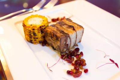A meat dish served with corn at Royal on the Park hotel
