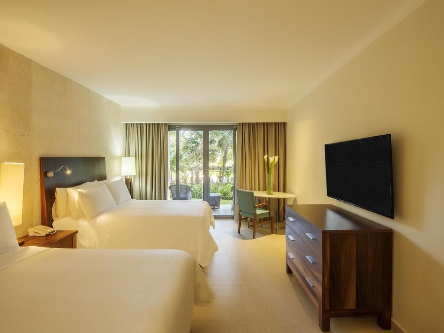 TV & beds in Premium Garden View room at FA Hotels & Resorts