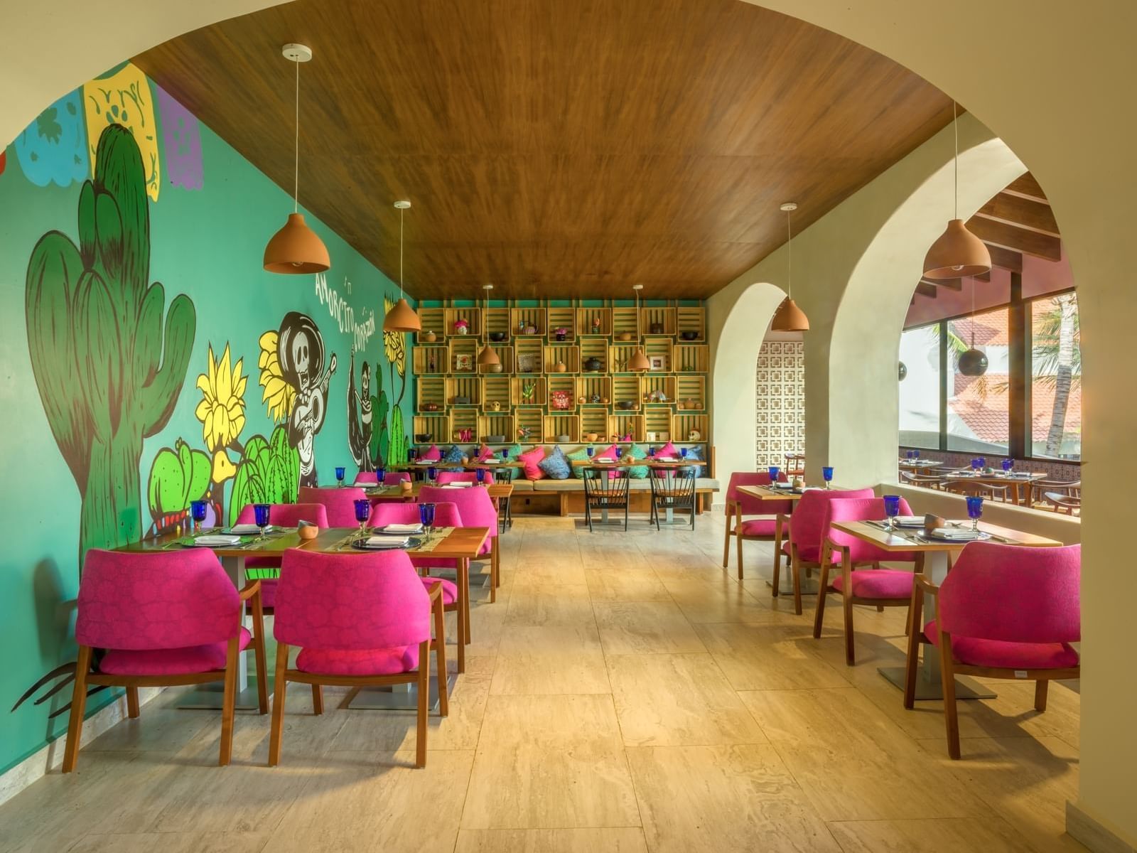 EI Mexicano colorful dining area with wall art at La Colección