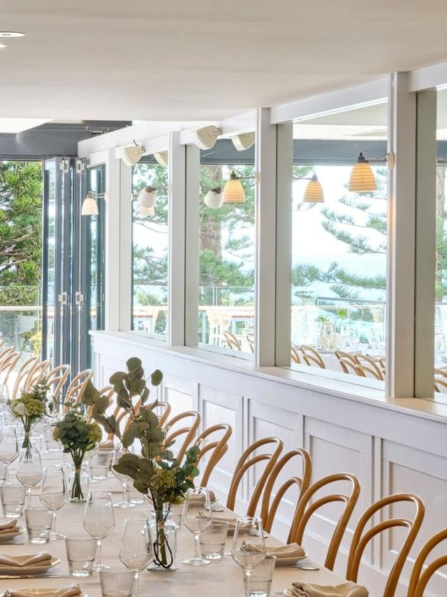 Cibaria\'s Terrazza at Elysium Manly with a long table surrounded by light wood chairs, mirrors, a featured hotel in Manly