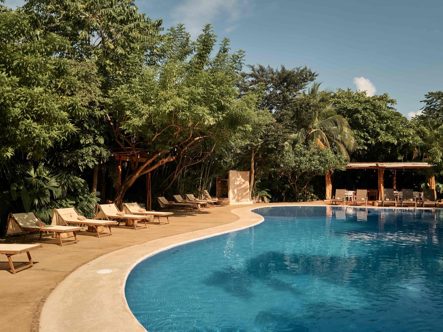 Cala Luna Hotel Boutique outdoor pool with lounge chairs with a Deal 15% Discount.