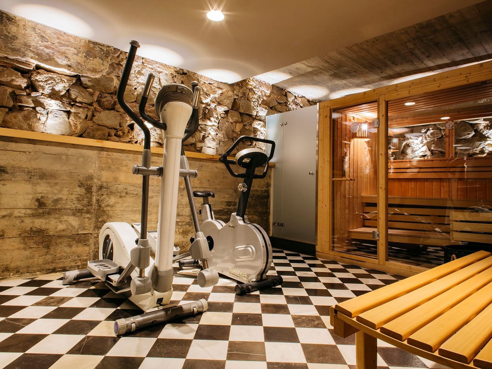 Exercise machines in a gym at Barcelona Apartment