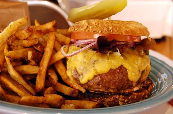 Burger & fries served in a Restaurant at Nesuto Stadium Hotel and Apartments