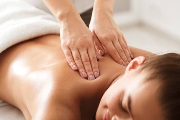 Lady enjoying body massage at Orsett Hall Hotel