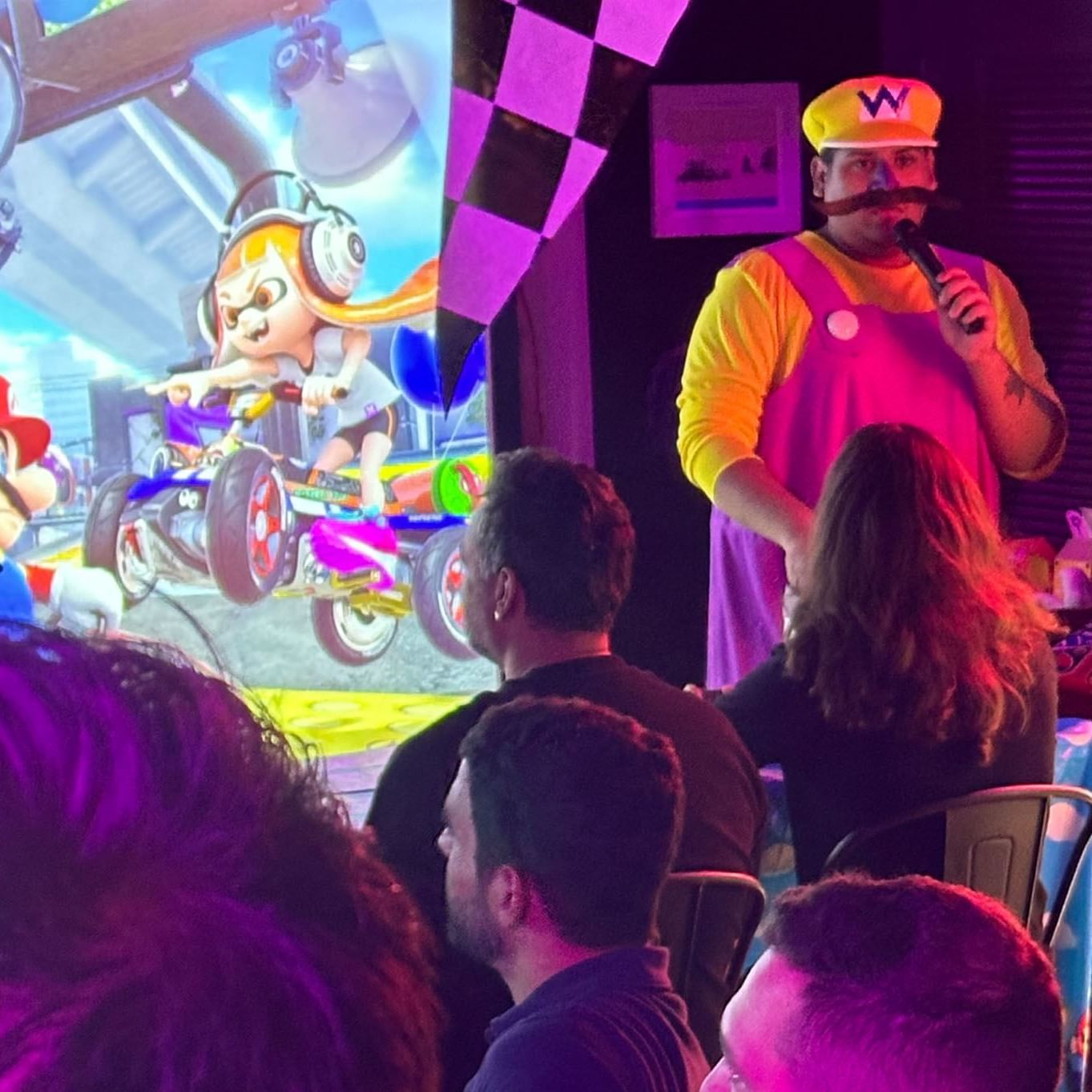 Colorful gaming event with Mario Kart characters and a costumed entertainer engaging the crowd at The Gaythering