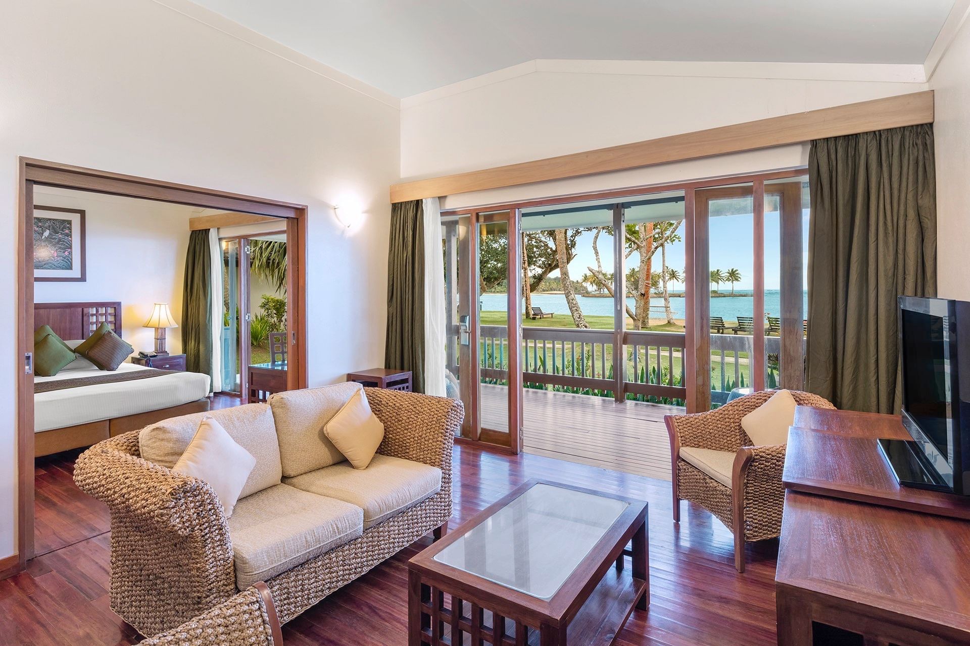 Bedroom & lounge area in One-Bedroom Villa at Naviti Resort