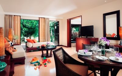 Living room of Two-bedroom suite villa that you and your kids can spend time together at Paradox Resort Phuket