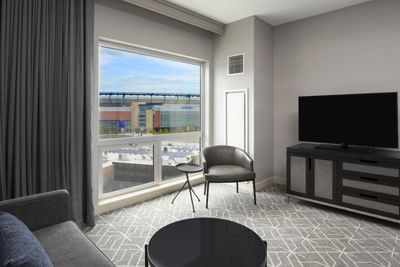 room with grey décor and view to gillette stadium