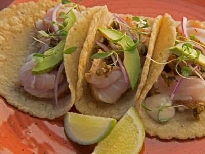 Close-up of tacos with lemons at Cala de Mar
