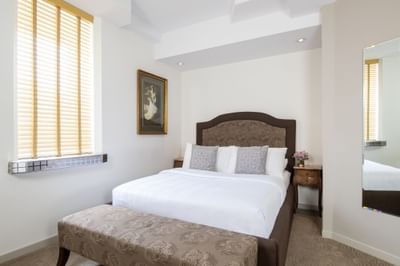 Comfy bed in Queen Premiere chic antique at Retro Suites Hotel