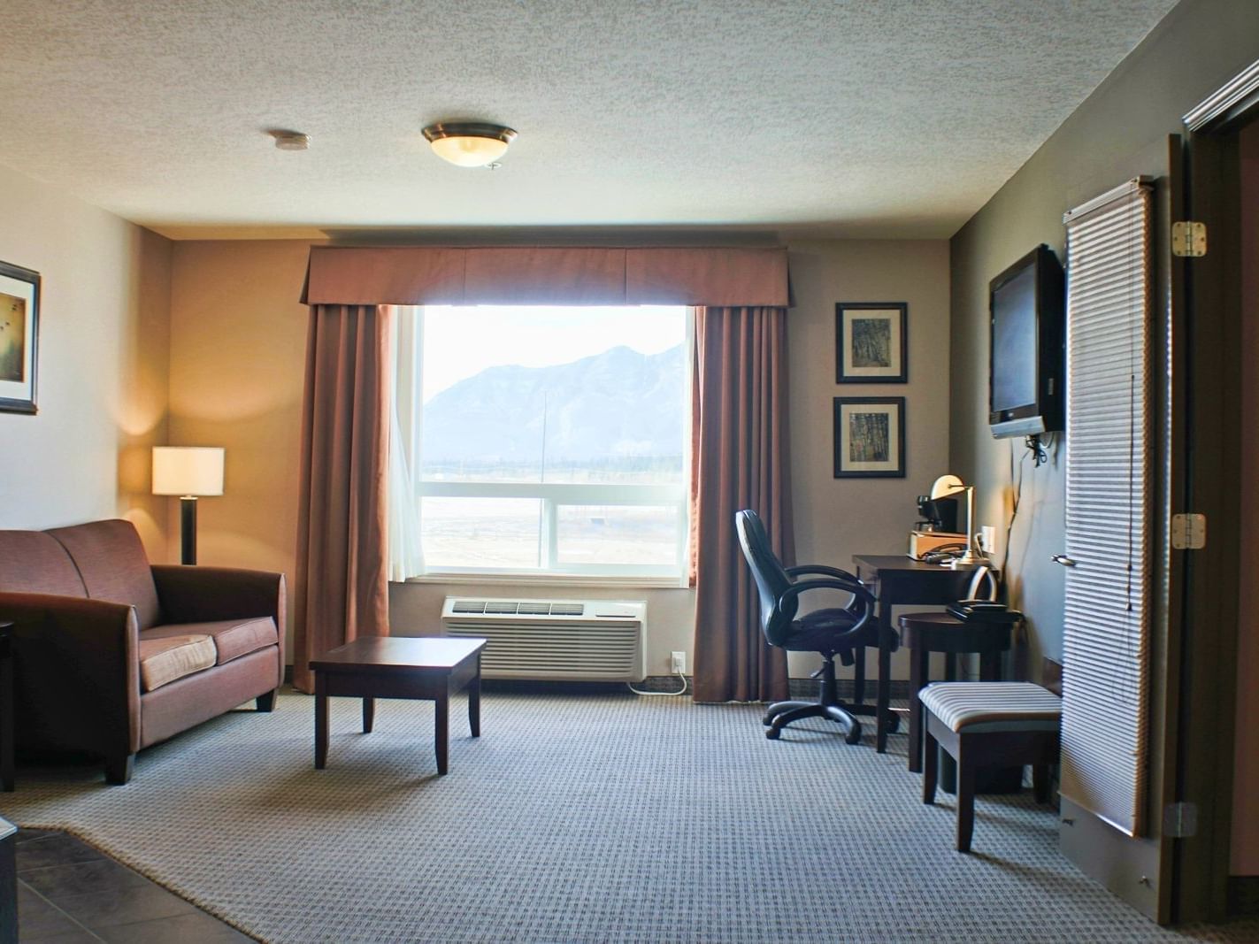 Living area in Jetted Tub Suite at Stoney Nakoda Resort
