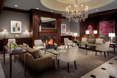 Cozy lobby area with armchairs & couches at The Townsend Hotel
