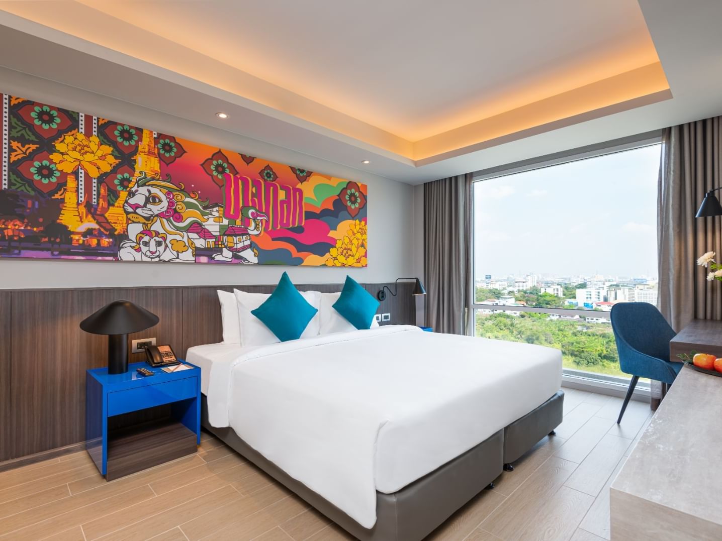 King bed in Grand Deluxe Room at Maitria Hotel Rama 9 Bangkok