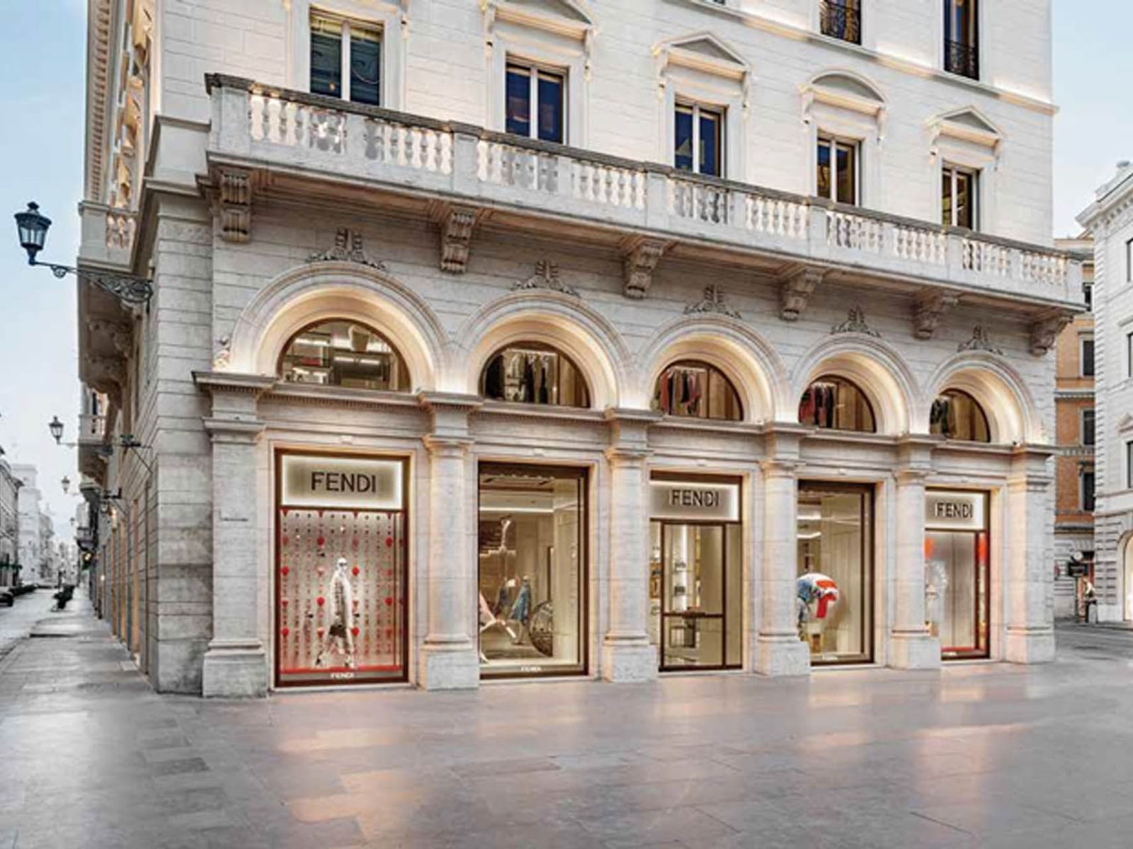 Elegant Fendi store in a historic building with arched windows and stylish displays near The Guardian Hotel