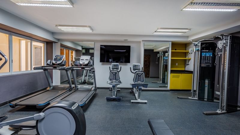 Exercise machines in a gymnasium at Gamma Hotels