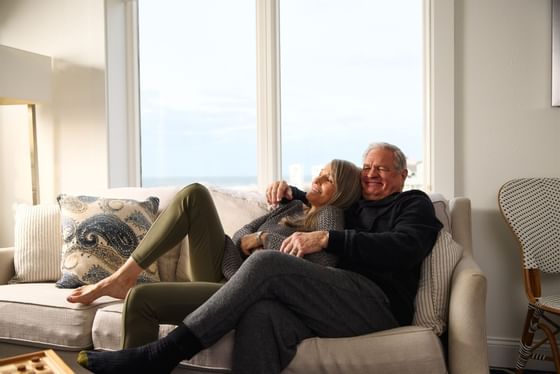 An older couple relaxes on the couch at our hotel in Cape May NJ
