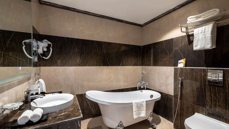 Bathtub with vanity area in bathroom of Panorama Suite at Warwick Riyadh